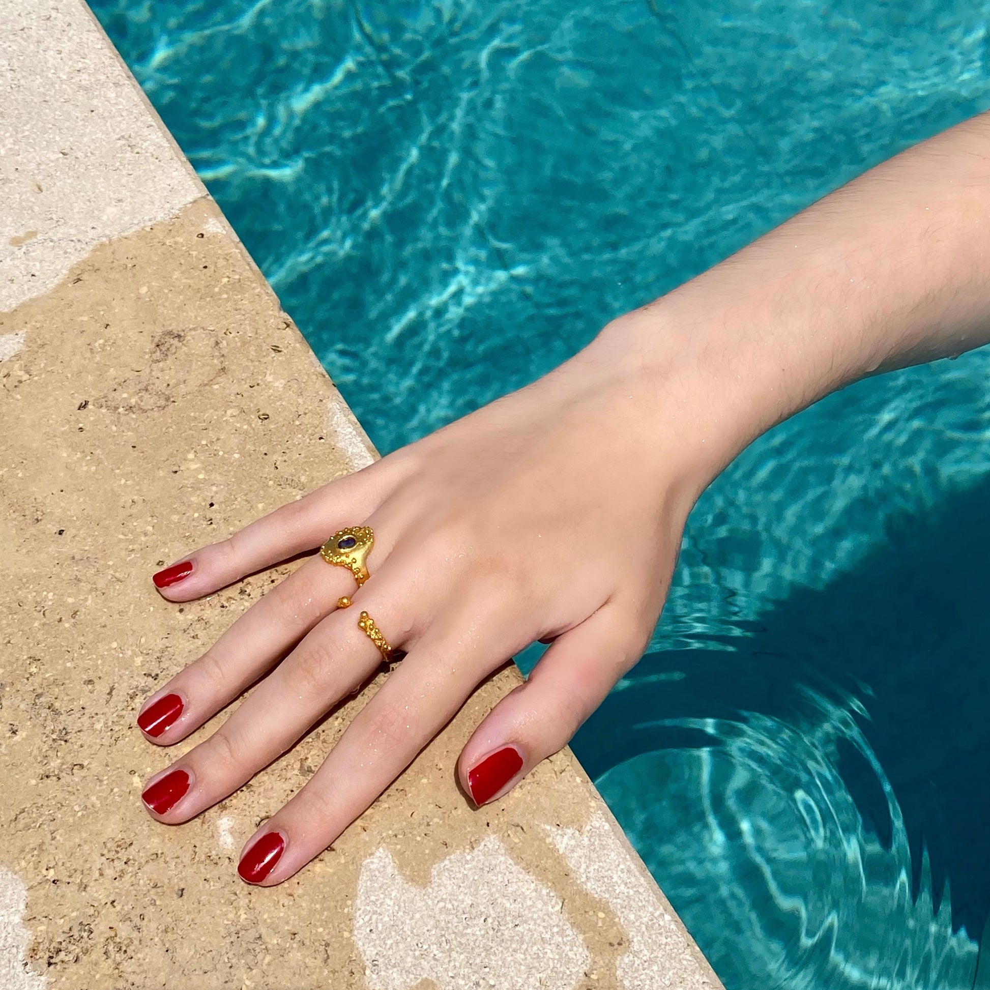 Sunken treasure ring by Vivienne Benz, gold vermeil signet ring with blue sapphire