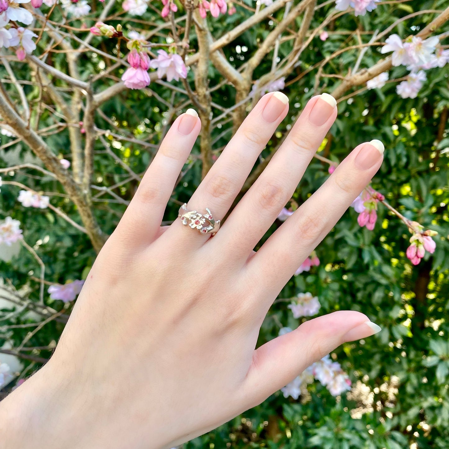 Silver cherry blossom ring with padparadscha sapphires