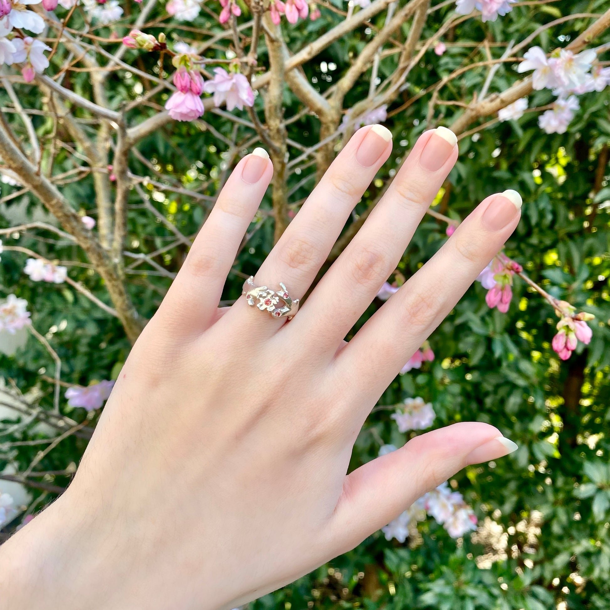 Silver cherry blossom ring with padparadscha sapphires