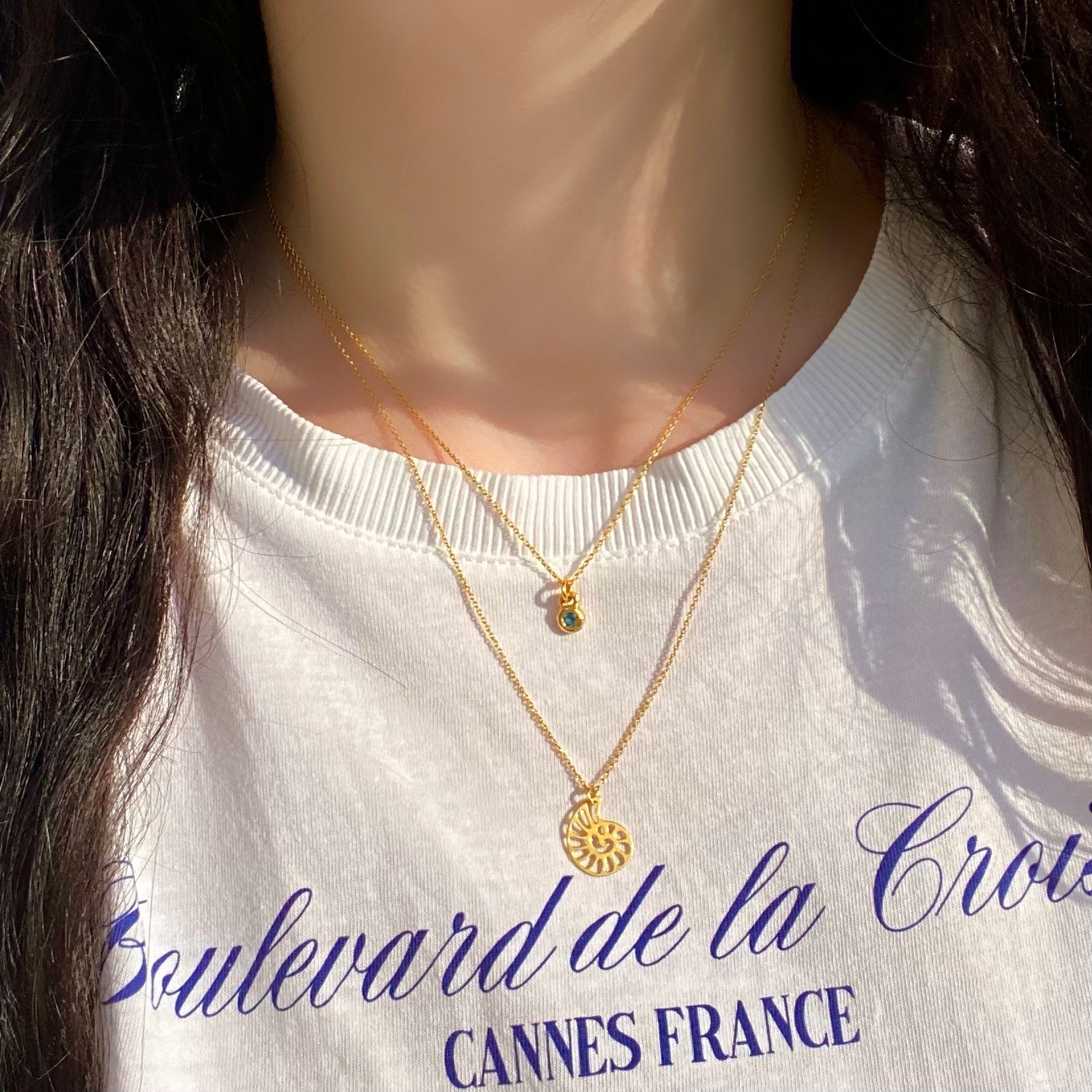 Dainty gold necklaces by Vivienne Benz, nautilus necklace