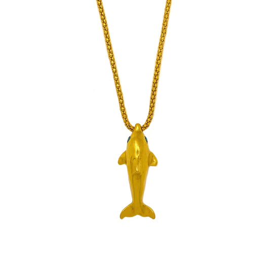 Gold dolphin pendant with blue sapphire