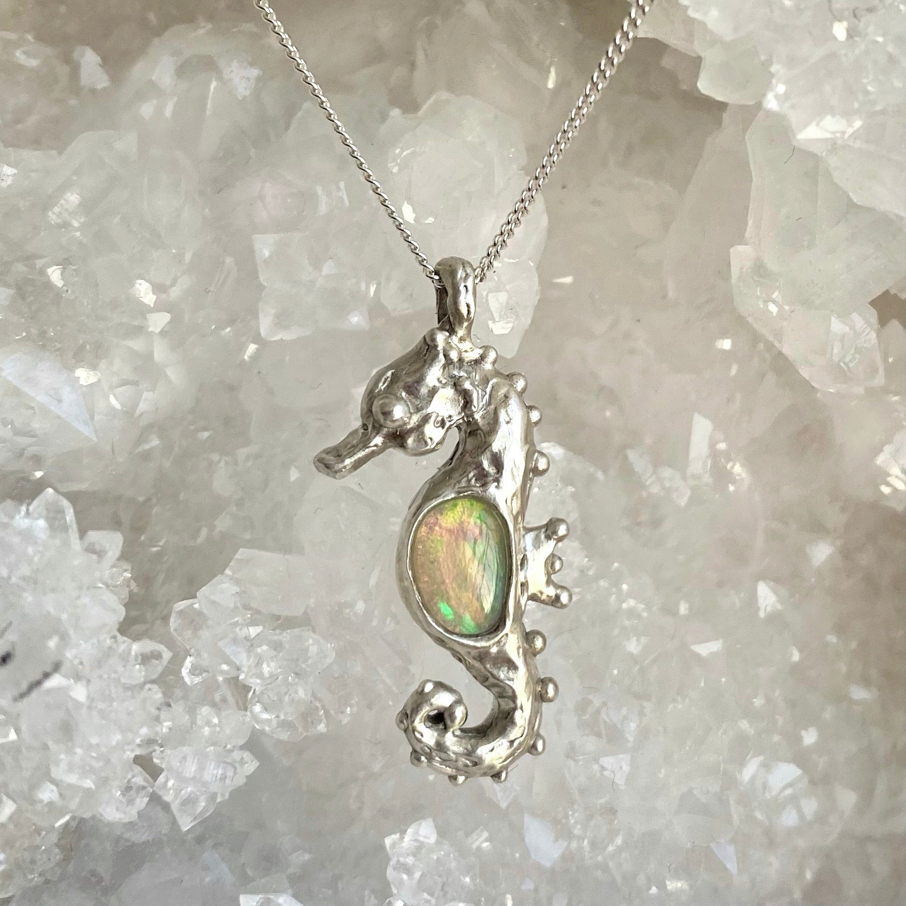 Hand carved seahorse pendant with opal belly