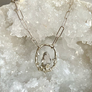 Clear quartz pendant with hand carved organic crystal textures