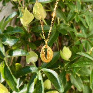 Golden cowrie shell necklace