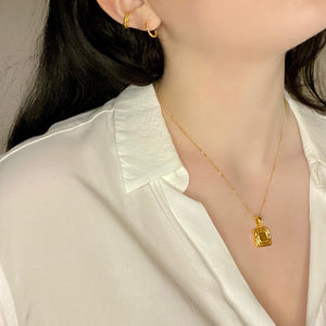 Gold vermeil necklace, hoop earrings and ear cuff